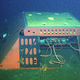 The Monterey Accelerated Research System (MARS) cabled observatory, a node for science instruments on the ocean floor 891 meters (2,923 feet) below the surface of Monterey Bay, is connected to shore by a 52-kilometer (32-mile) undersea cable that carries data and power. About 20 kilometers of the cable was used to test a new concept called photonic seismology on the seafloor.